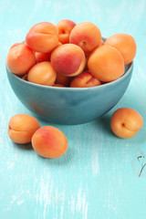 Apricots in blue bowl