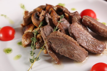 pieces of meat with mushrooms and pesto