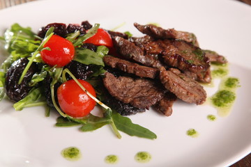 juicy meat with pesto and salad