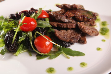 juicy meat with pesto and salad