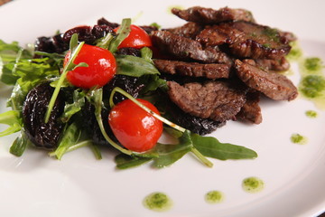 juicy meat with pesto and salad