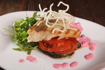 Pike with tomatoes and eggplant