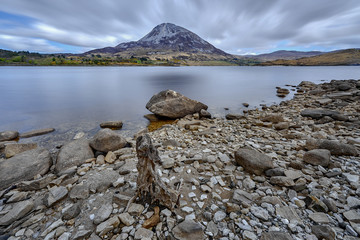 Mount Errigal, Co. Donegal, Ireland, reflected in blue lake surrounded by peatland in national park, nature