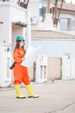 asian woman engineer wearing protective workwear at work