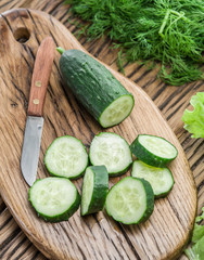 Cucumbers on the wooden table.
