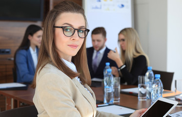 business woman with her staff, people group in background at modern bright office indoors