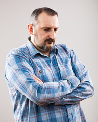 Obraz premium Studio shot portrait of worried pensive man