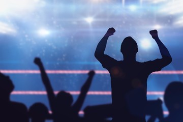 Composite image of silhouettes of football supporters