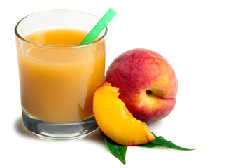 delicious and juicy peach with green leaves on white isolated background near the glass of juice and a piece of sliced peach