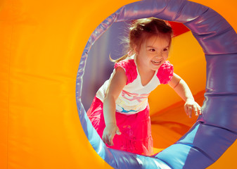 child on a colorful trampoline