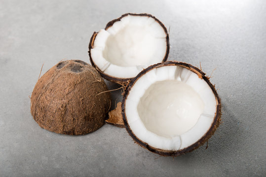 Coconuts shells on grey background