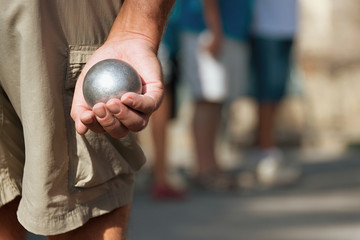 Senior playing petanque,fun and relaxing game