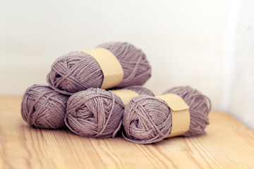 grey yarn on wood background