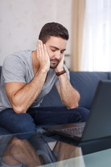 Man sleep in front of laptop