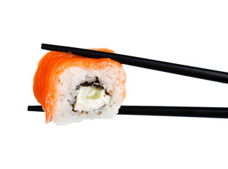 sushi roll in chopsticks Isolated on white