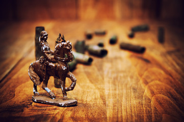 Old cartridge shells and figure of a soldier on horse