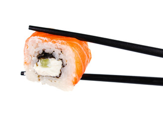 sushi roll in chopsticks Isolated on white