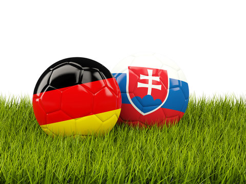 Germany and Slovakia soccer balls on grass