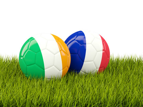 France and Ireland soccer balls on grass