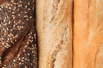  Bread of different varieties view from above. Rye, wheat and whole grain bread. Macro. Texture. Food background.
