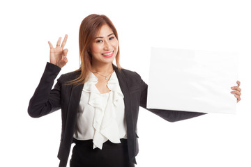 Young Asian business woman show OK with  white blank sign