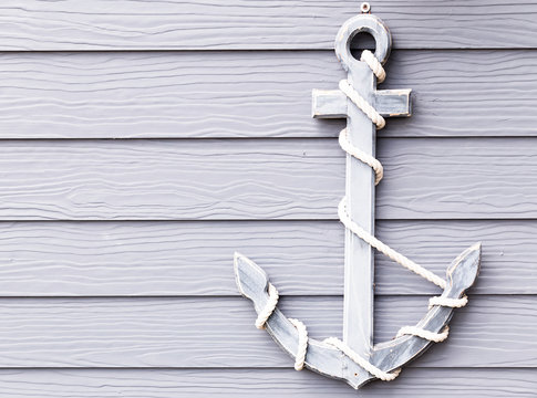wooden anchor on wall vintage background