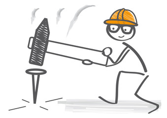 Handwerker schl&auml;gt mit Hammer Nagel ein