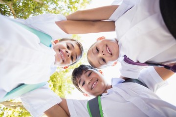 School kids forming huddle in campus