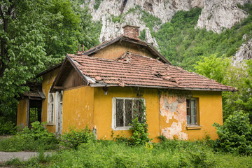 Facade of an abandoned house with broken windows