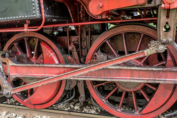 Fototapeta na wymiar Close up of huge steam locomotive wheels