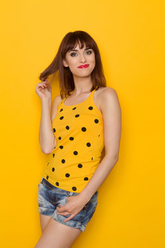 Happy Girl Agains Yellow Background