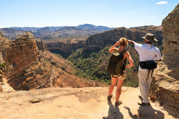 Tourist looking out over the beautiful landscape of Isalo national park in Madagascar