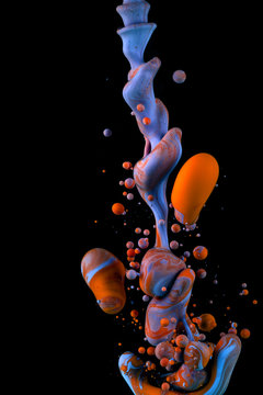 Color Liquid in dynamic flow forming interesting and unique shapes and bubbles. Colorful tones mixing in an unique pattern. Artistic design. Isolated on black background.