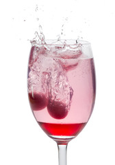 Red cocktail with splash isolated on white