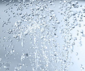 Splashed water drops. Fresh blue, transparent water. Natural background.