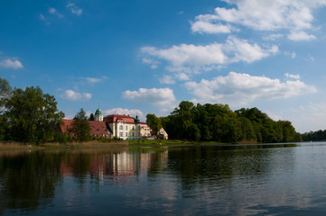 Old renovated palace on the lake in Trzyglow, Poland