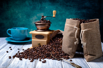 Jute bags with coffee beans and grinder