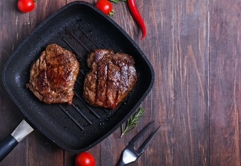 Roasted beef steaks in the pan