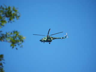 helicopter flies over the forest