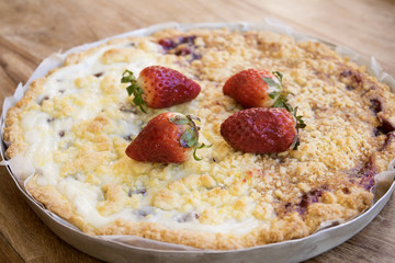 strawberry on a jam crumble tart