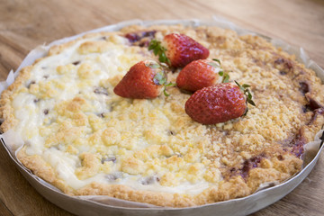 strawberry on a jam crumble tart