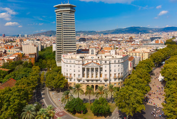 Aerial view over La Rambla from Christopher Columbus monument, with quarters of El Raval in...