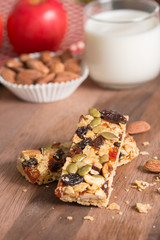 Cereal granola bars with nuts, dried fruit and milk.