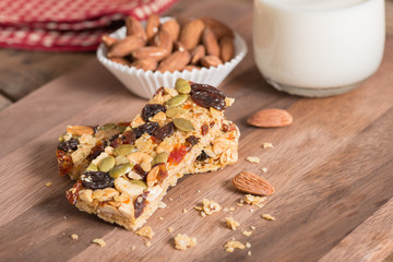 Cereal granola bars with nuts, dried fruit and milk.