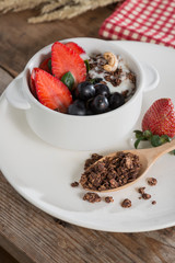 Chocolate granola with fresh strawberry, greap, almond and yogur