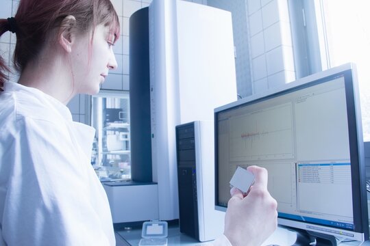 Scientist using computer in lab