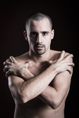 Fototapeta premium Natural portrait of guy in studio over brown background