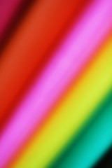 Abstract paper stack defocused colourful background. Paper stack of different colors defocused