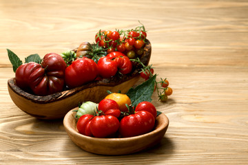Fresh heirloom tomatoes on wooden table