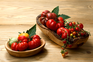 Fresh heirloom tomatoes on wooden table